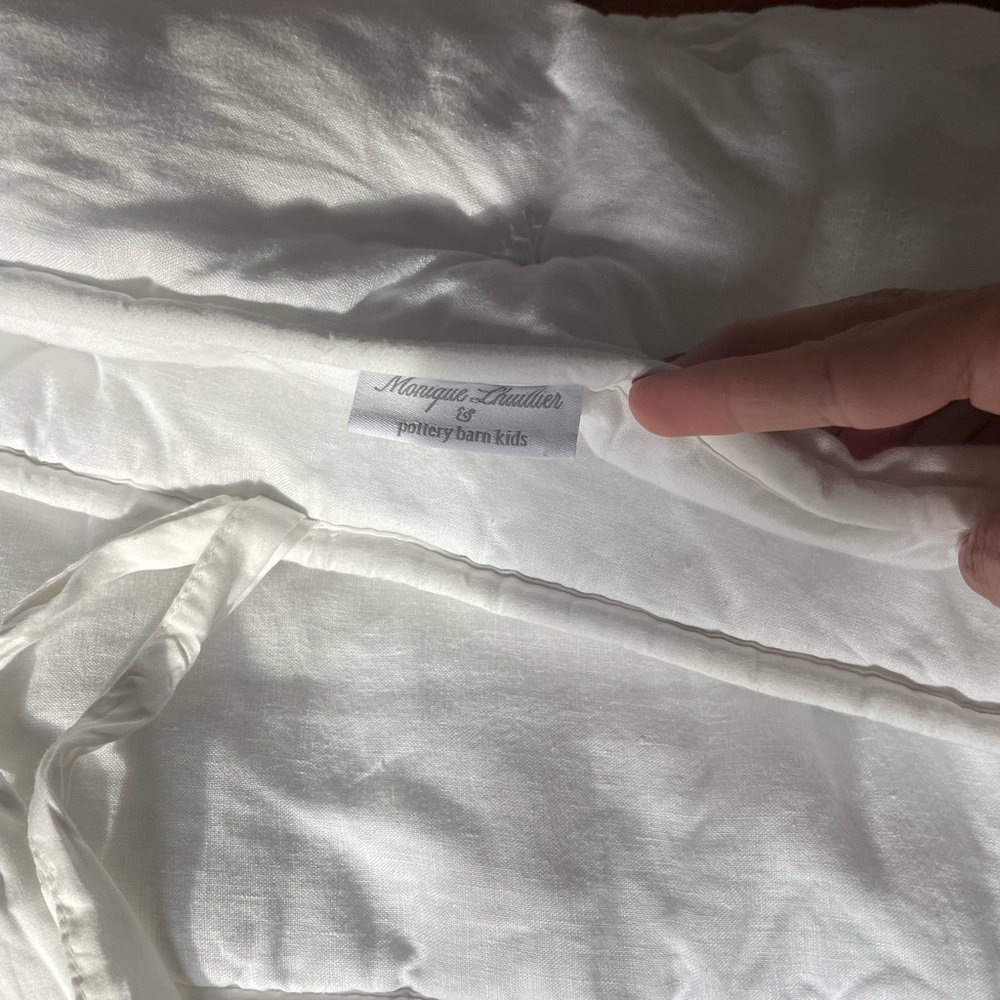 Beautiful Monique Lhuillier x Pottery Barn Kids white linen crib bumper.